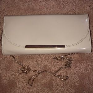 Patent nude leather clutch on gold chain
